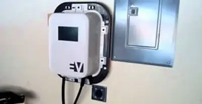 Electric car charger installation with wall-mounted EV charging station in Evansville, IN