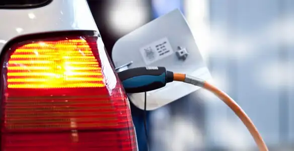 Electric car plugged into EV charger after professional installation in Evansville, IN