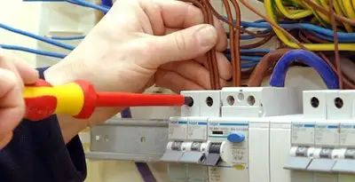 electrician services performing professional electrical panel wiring and connections in Evansville, IN