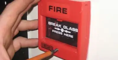 fire alarm installation service showing manual fire alarm pull station installed by licensed electricians in Evansville, IN