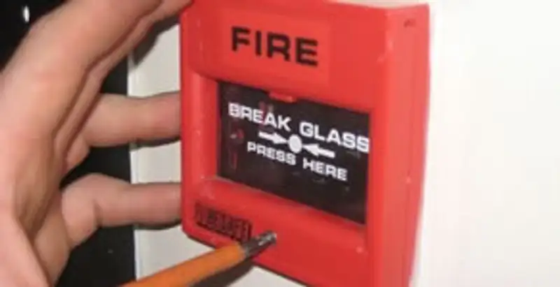 fire alarm installation service showing manual fire alarm pull station installed by licensed electricians in Evansville, IN