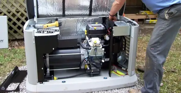 generator installation service showing technician connecting and configuring generator components in Evansville, IN