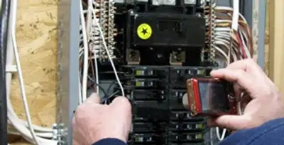 Home electrical inspection of circuit breaker panel by licensed electrician in Evansville, IN