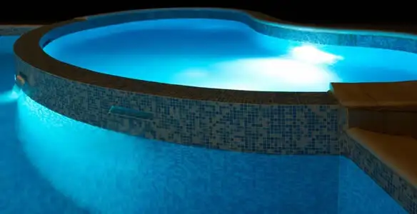 pool light installation and repair services highlighting illuminated pool interior lighting in Evansville, IN