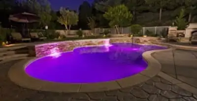 pool light installation and repair services illuminating a residential swimming pool in Evansville, IN
