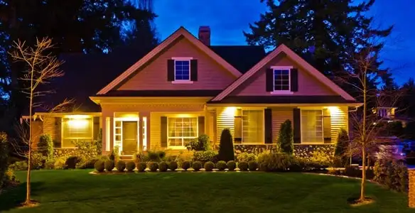 security light installation services illuminating a residential exterior at night in Evansville, IN