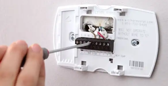 Thermostat installation service with proper wiring and secure wall mounting in Evansville, IN