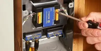 Whole home surge protection device being installed by a licensed electrician to protect electrical systems in Evansville, IN